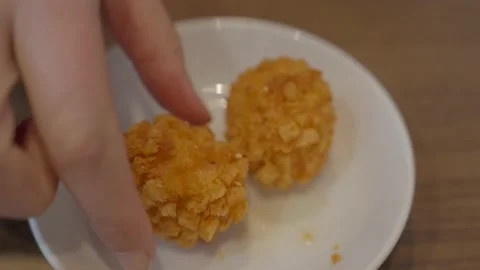 Hand picks up fried shrimp ball close up Video stock 228998575