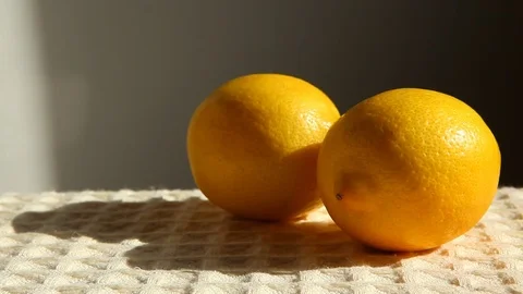 Hand picks up lemon Stock Footage 73012860