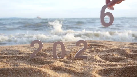 Hand picks out the number 5, changing from year 2025 to 2026 Stock Footage 321693512
