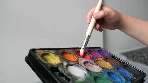 Hand picks up paint with a brush Stock Footage 156675782