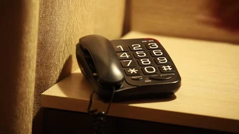 Hand Picks Up The Phone, put on the bedside table Stock Footage 297318587