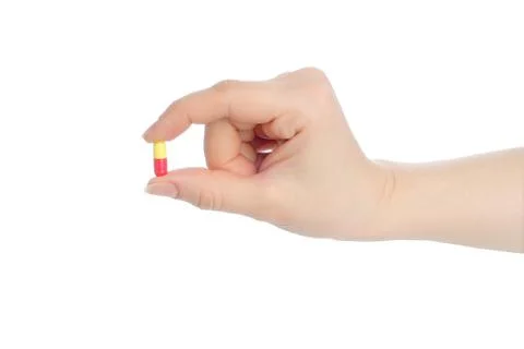 Hand with pill Stock Photos