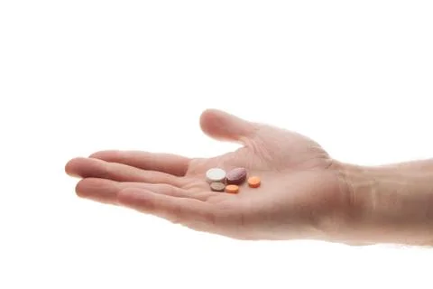 Hand with pills Stock Photos