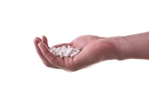 Hand With Pills Stock Photos