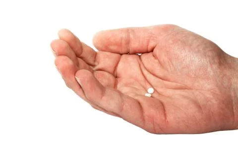 Hand with pills Stock Photos
