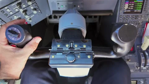 Hand of a Pilot on the Flight Controls of a Jet Airplane. Close-up view. Stock Footage 338186761