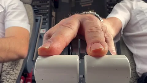 Hand of a Pilot Operating the Engine Throttle Levers. Extreme Close-up, Low Stock Footage 331620789