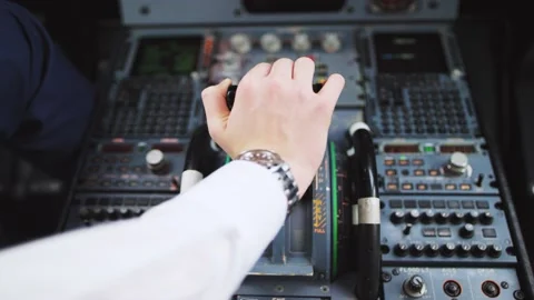 Hand of pilot push thrust lever handle for engine control takeoff. 4K video. Stock Footage 132262536
