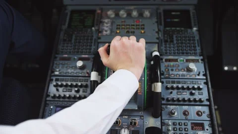 Hand of pilot push thrust lever handle for engine control takeoff. 4K video. Stock Footage 132264676