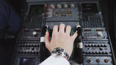 Hand of pilot push thrust lever handle for engine control takeoff. 4K video. Stock Footage 132345636