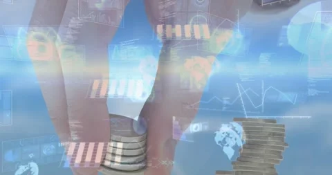 Hand pinching coin stack activating HUD data, globes and charts, stacking for Stock Footage 328495803