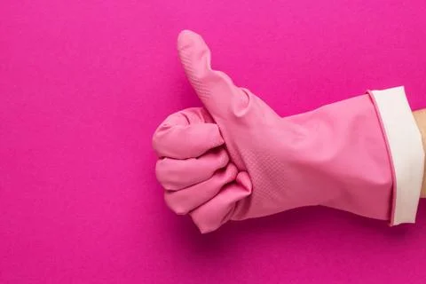 Hand in pink protective glove Stock Photos