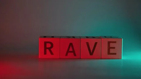 Hand places colored letter blocks on a table to spell different words. The Stockbeeldmateriaal 338187708