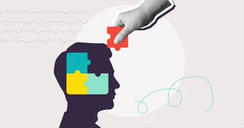 A hand places the missing puzzle piece into a human head Stock Footage 309623308