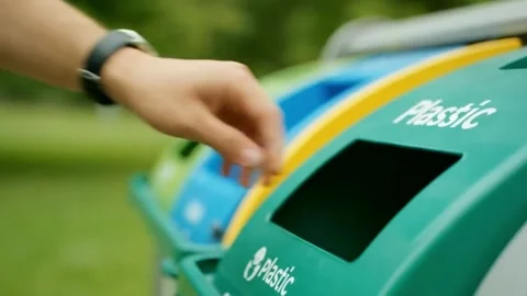 Hand Placing Bottle into Recycling Container. Stock Footage 316279461