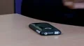 Hand placing cell phone on desk HD Footage