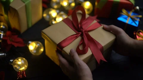 Hand Placing Christmas Present Stock Footage 97255443
