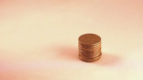 Hand placing coin in the money stack Stock Footage 59956318