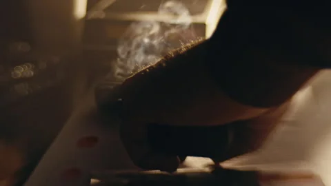 Hand Placing Down Smoking Gun Stock Footage 274570913