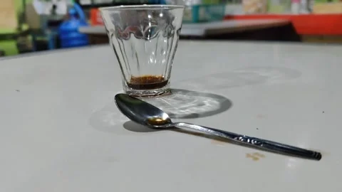 Hand placing an empty coffee cup on the table Stock Footage 321415315