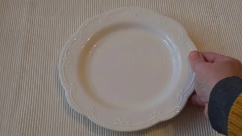 Hand Placing Empty White Plate on Table, Minimal Dining Concept Stock Footage 337014550