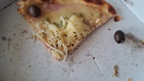 Hand placing fresh black olive onto cheesy pizza slice motion footage Stock Footage 337897088