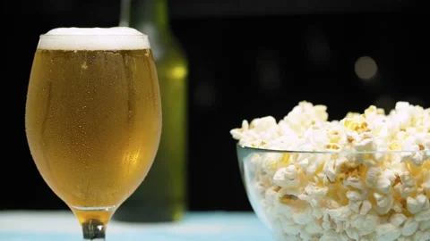 Hand placing glass of beer Stock Footage 140354738