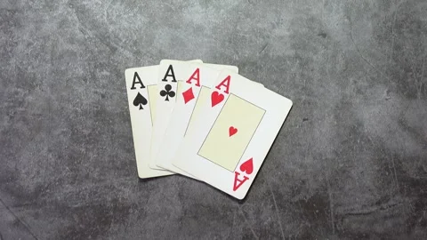 Hand placing a poker of aces Stock Footage 278920722