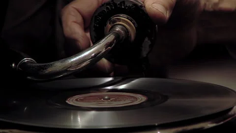Hand Placing Record and Lowering Needle on Antique Mechanical Gramophone - 4K Stock Footage 336685622