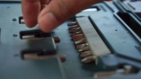 Hand placing screwdriver bit into toolbox case, close up shot, workshop tool Stock Footage 345289058