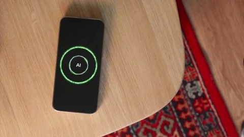 Hand placing smartphone with active AI voice assistant on table Video stock 346834818