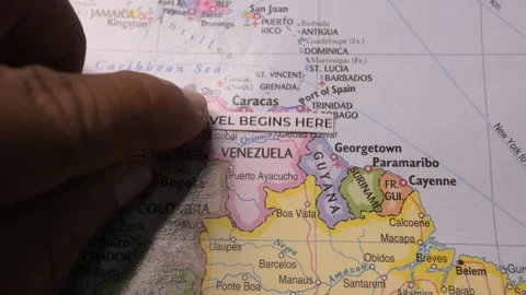 Hand Placing Travel Begins Here Label on Map of South America Stock Footage 346432287