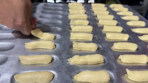 Hand Placing Uncooked Cookie Dough on Baking Tray, Close-Up Stock Footage 325304030