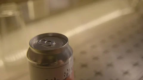 Hand Placing Unopened Beverage Can on Bar Counter in Beijing Indoor Food Scene Stock Footage 345758922