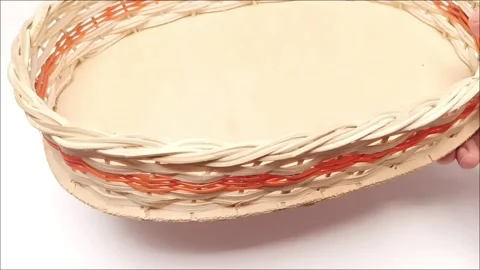 Hand Placing Woven Rattan Fruit Basket Tray on White Studio Table Stock Footage 344380615