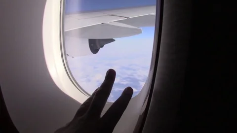 Hand on a plane window Stock Footage 88243660