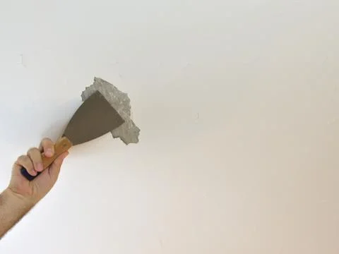 Hand with a Plaster Spatula Stock Photos