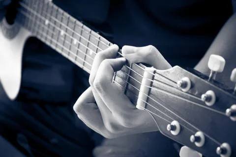 Hand play guitar Stock Photos