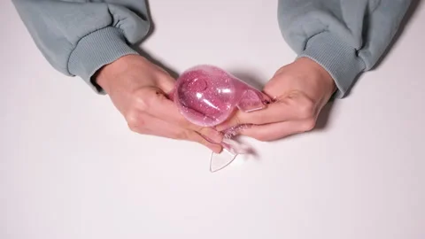 Hand play with Squeeze pink fish Hand Wrist Exercise Antistress Toy. Stress Stock Footage 166587694