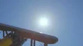 The hand play with a wood plane on the background of a bright sun 4k or 4k+ Resolution