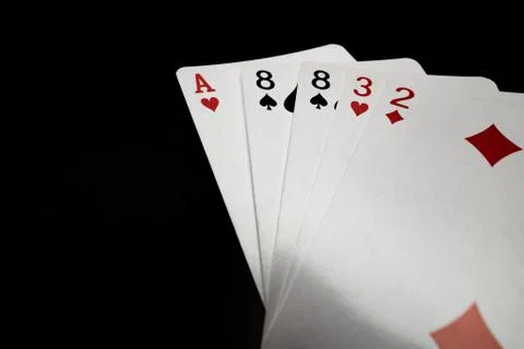 Hand of playing cards on black background Stock Photos