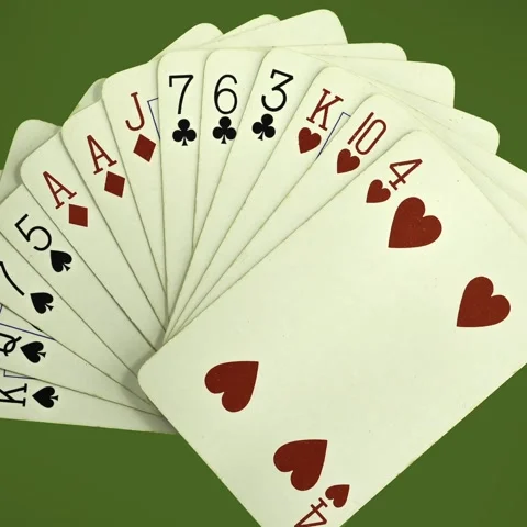 Hand of playing cards turning (including two ace of diamonds) with zoom Stock-Footage 229671534