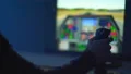 The hand playing in computer game with a joystick. evening night time 4k or 4k+ Resolution