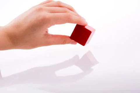 Hand playing with cube Foto stock