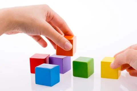 Hand playing with cubes Stock Photos
