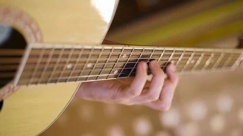 Hand playing the guitar Stock-Footage 91717257