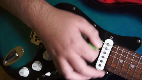 Hand playing guitar Stock Footage 140472679