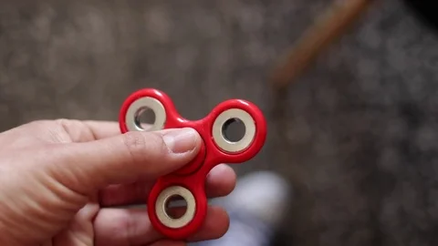 Hand playing spinner Stock Footage 75642101
