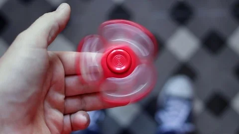 Hand playing spinner Stock Footage 75642111