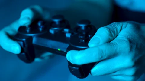 Hand playing on video game controller, close-up Stock Footage 258245306